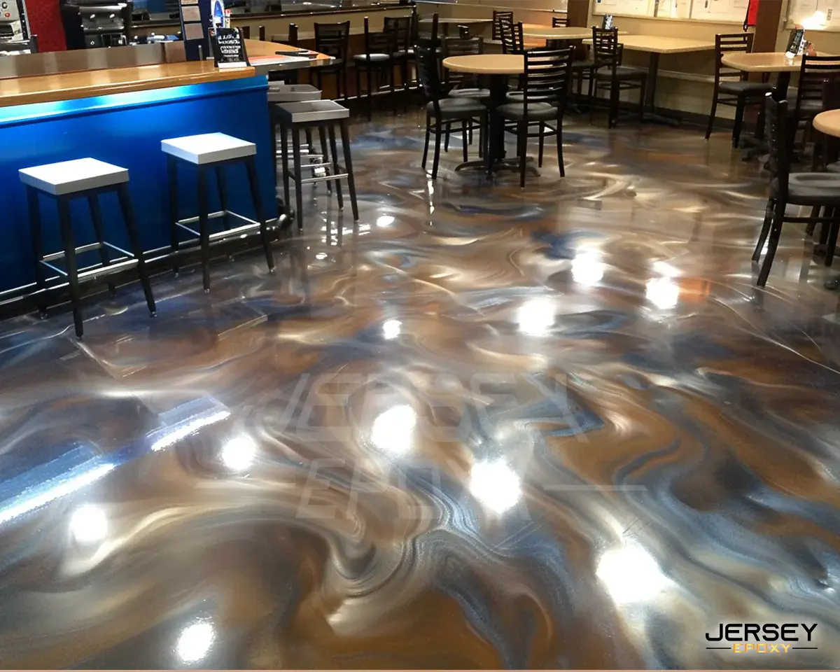 Polished epoxy flooring with a swirling metallic finish in a restaurant setting.
