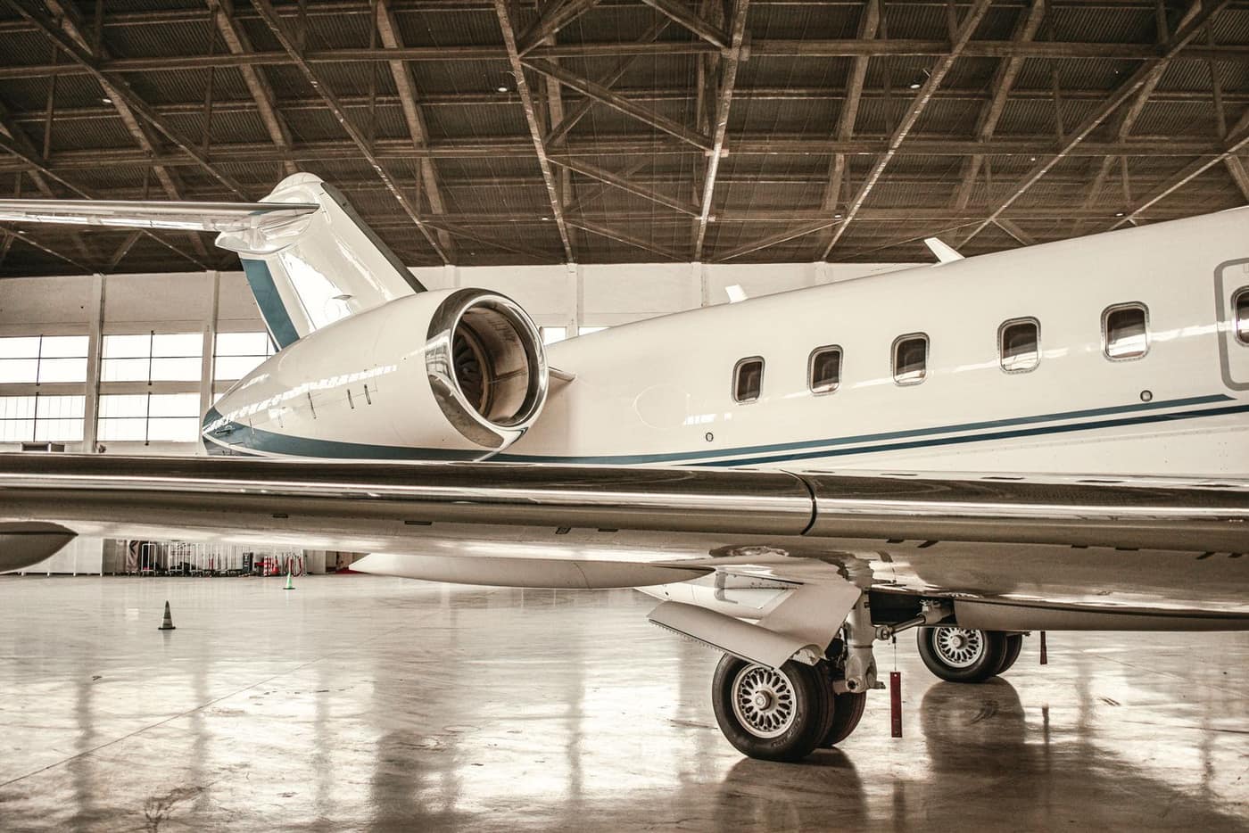 High-gloss epoxy hangar deck under parked aircraft