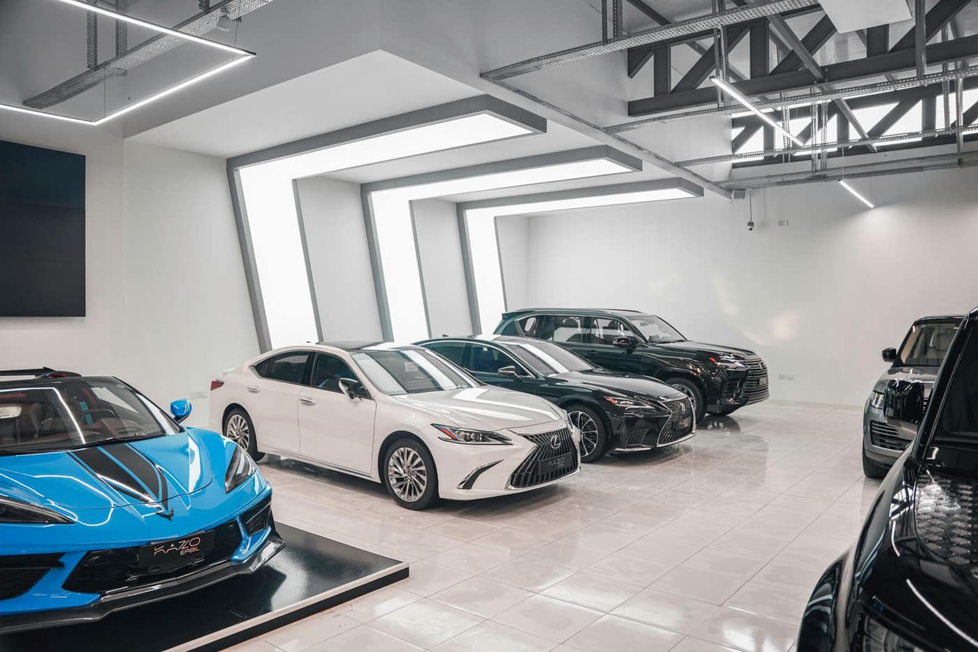 Deep reflective metallic epoxy floor in a vehicle showroom