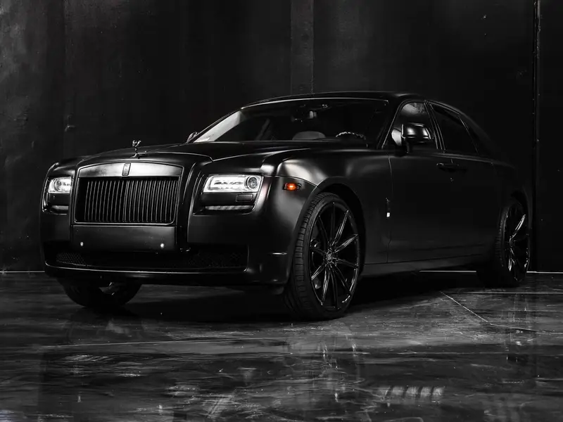 Luxury vehicle on a high-gloss reflective dealership showroom floor