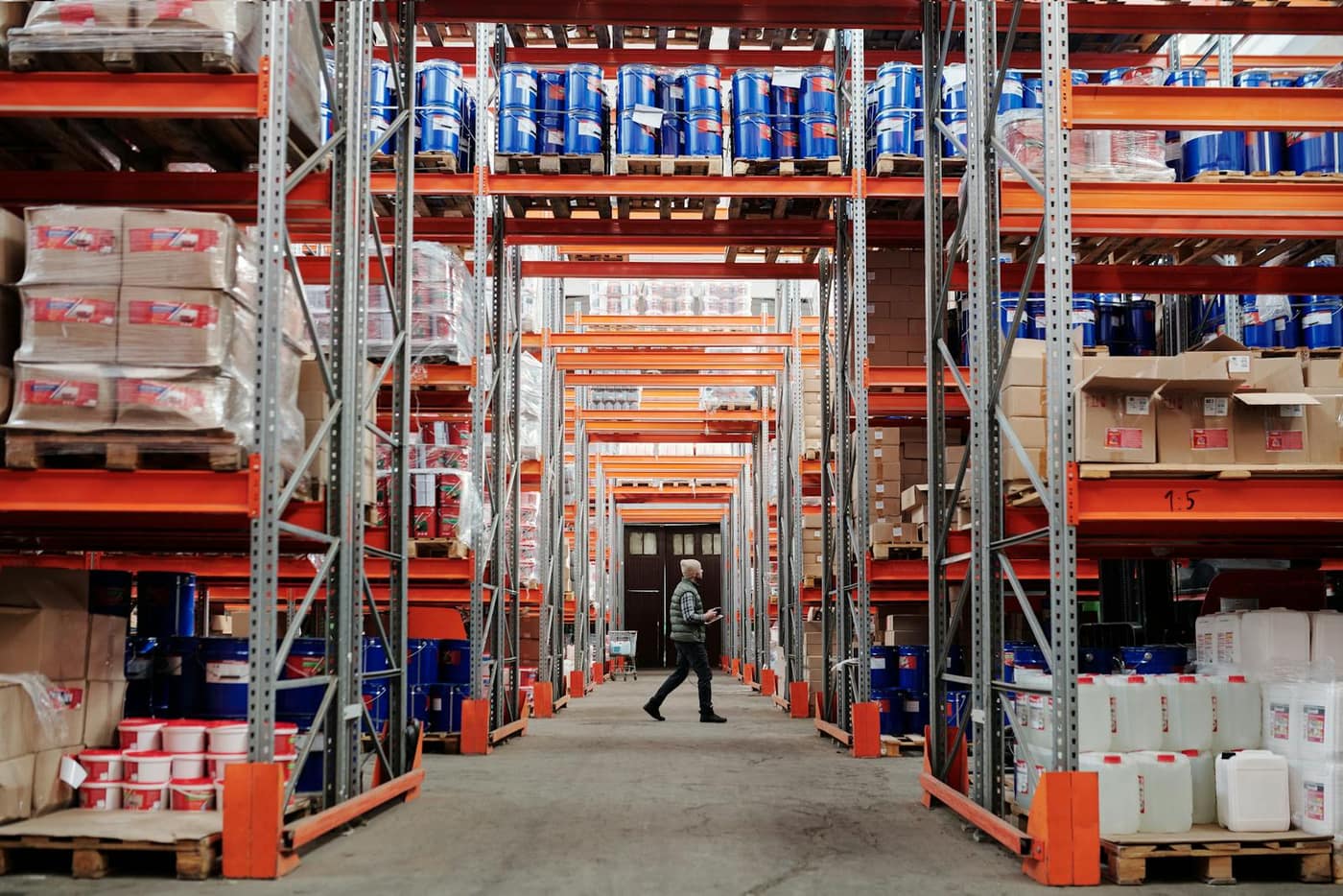 Long polished aisle running between high storage racking