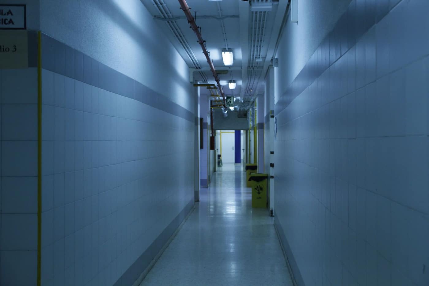 Hospital corridor under heavy daily traffic from beds and carts