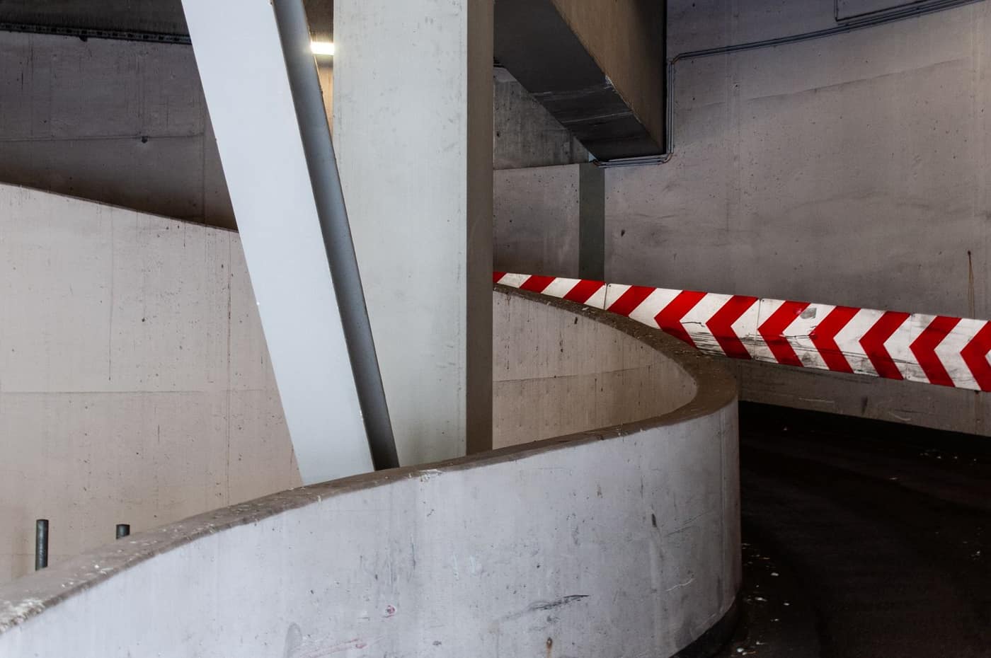 Coated parking-garage ramp interior with a sealed deck surface