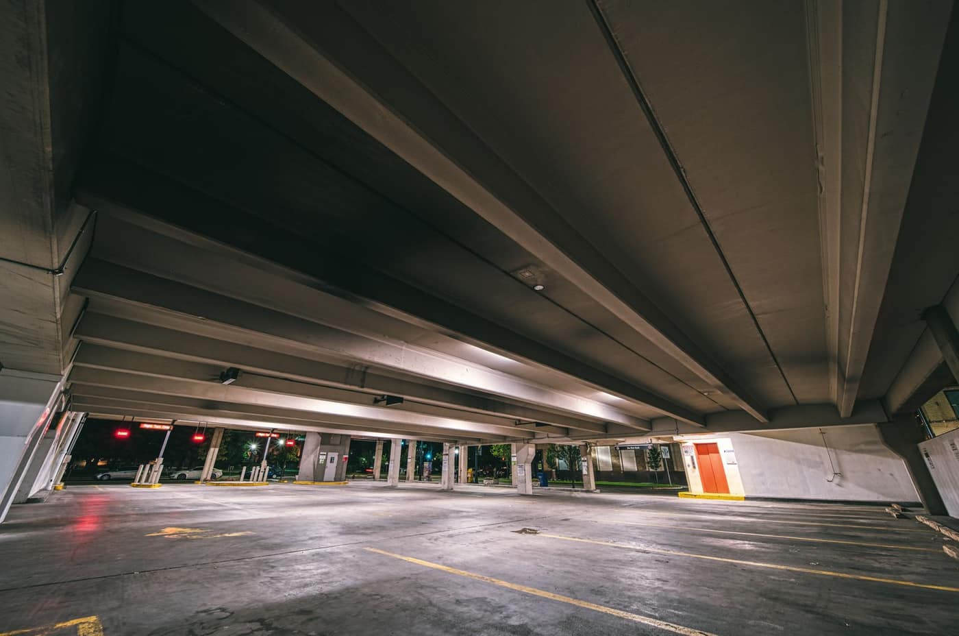 Empty multi-level parking deck lit at night