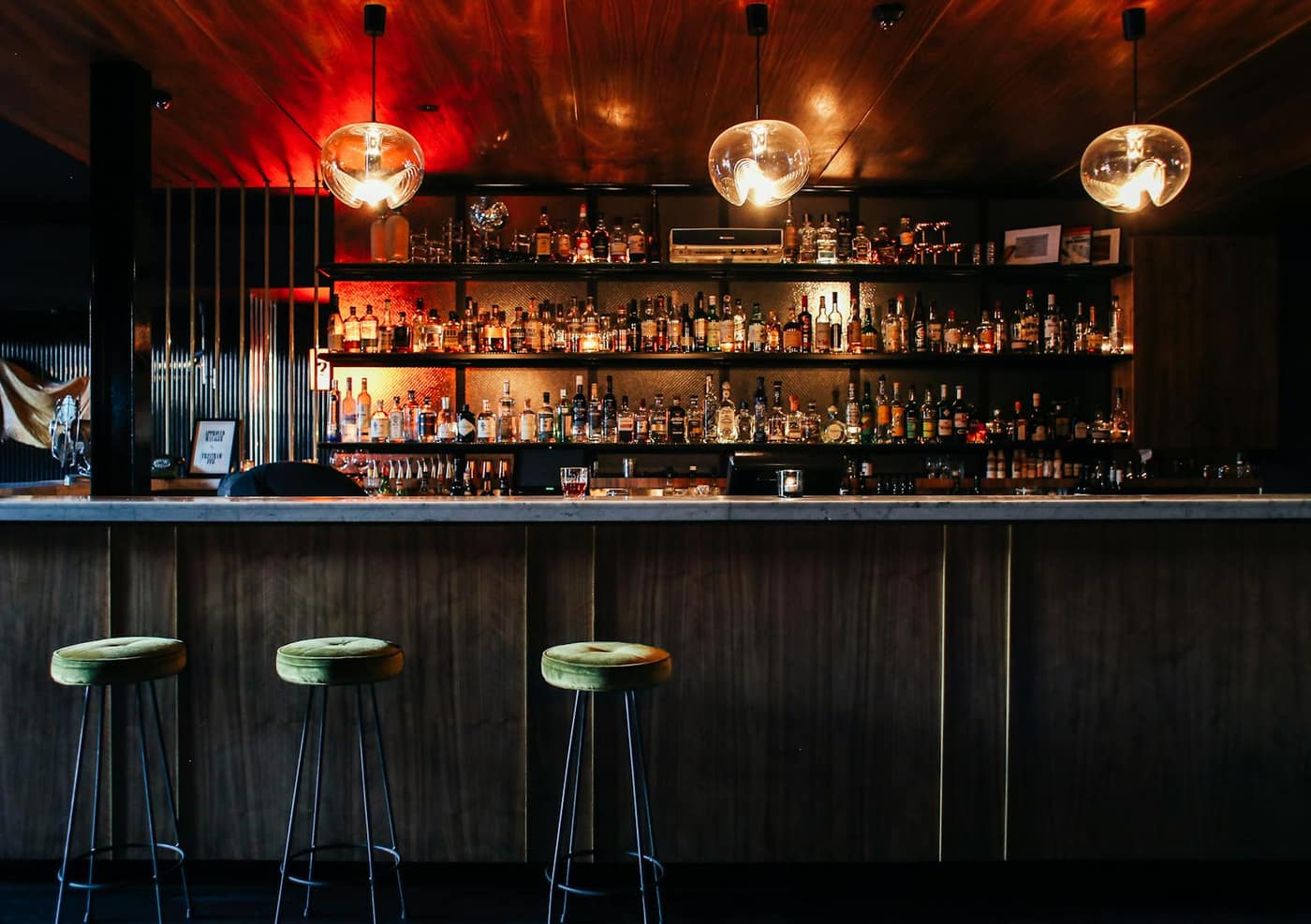 Glossy metallic epoxy floor in a stylish bar