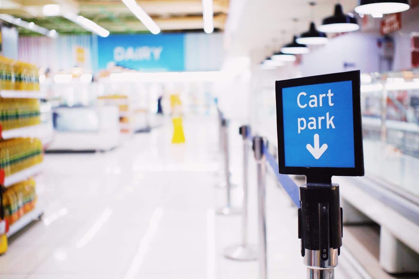 Row of shopping carts staged on a store floor near the entrance