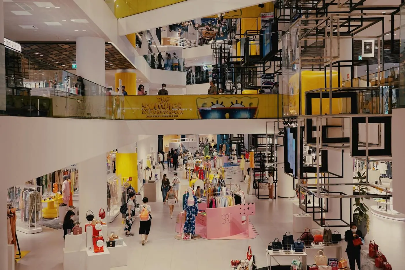 Open retail shopping floor with seamless flooring running the length of the aisles