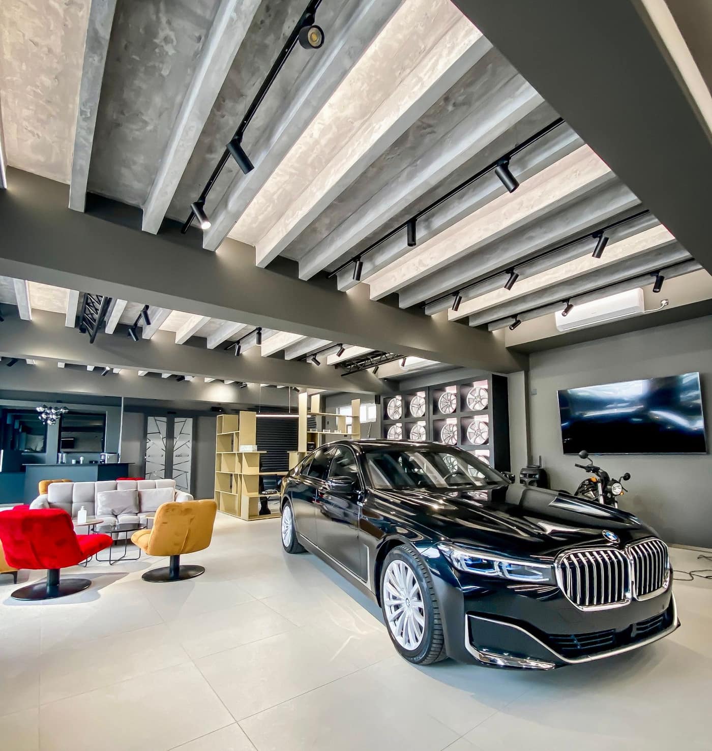 Sleek light-reflective polished concrete floor in a display space