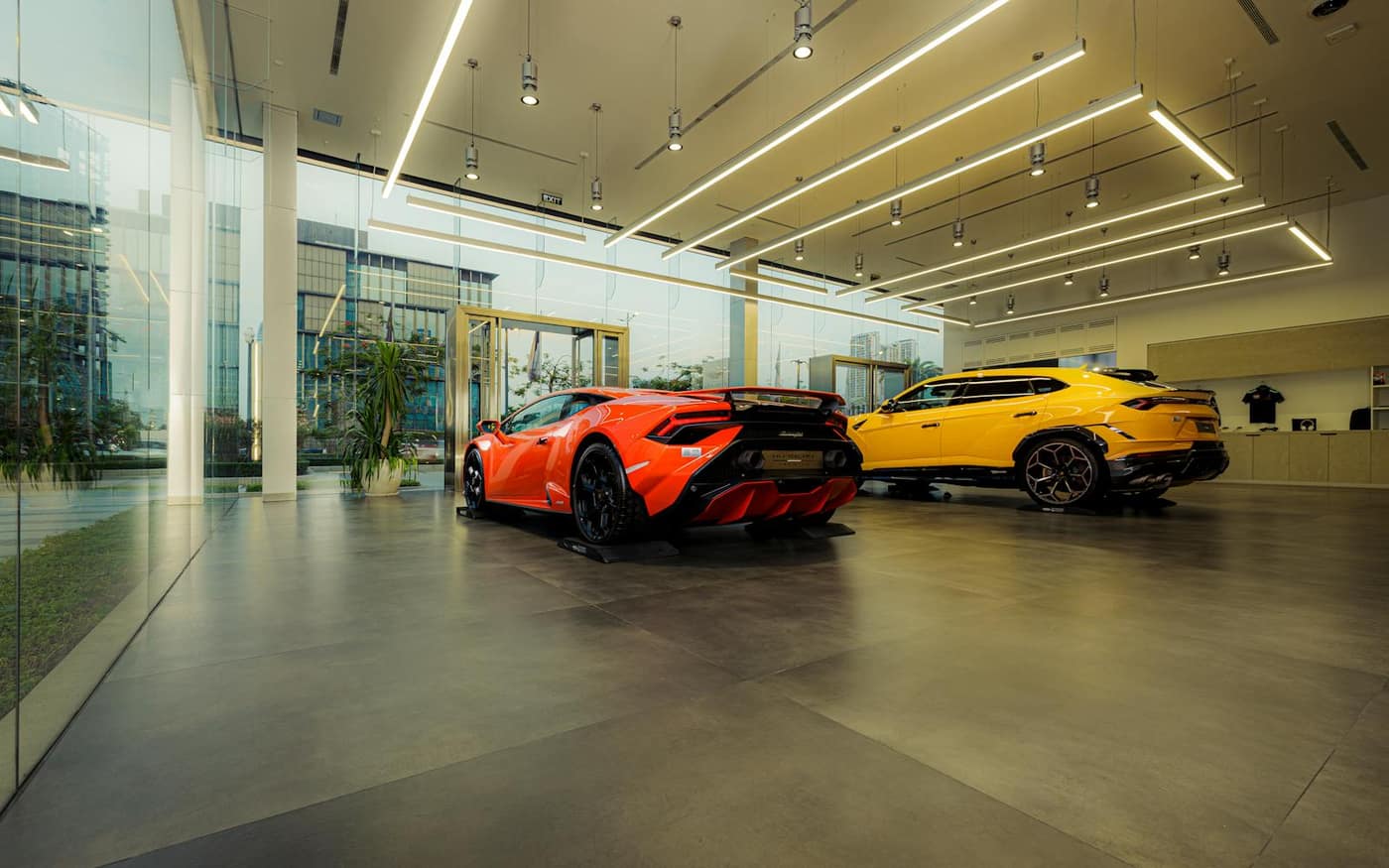 Detailed vehicle staged on a glossy showroom floor showing overhead light reflections