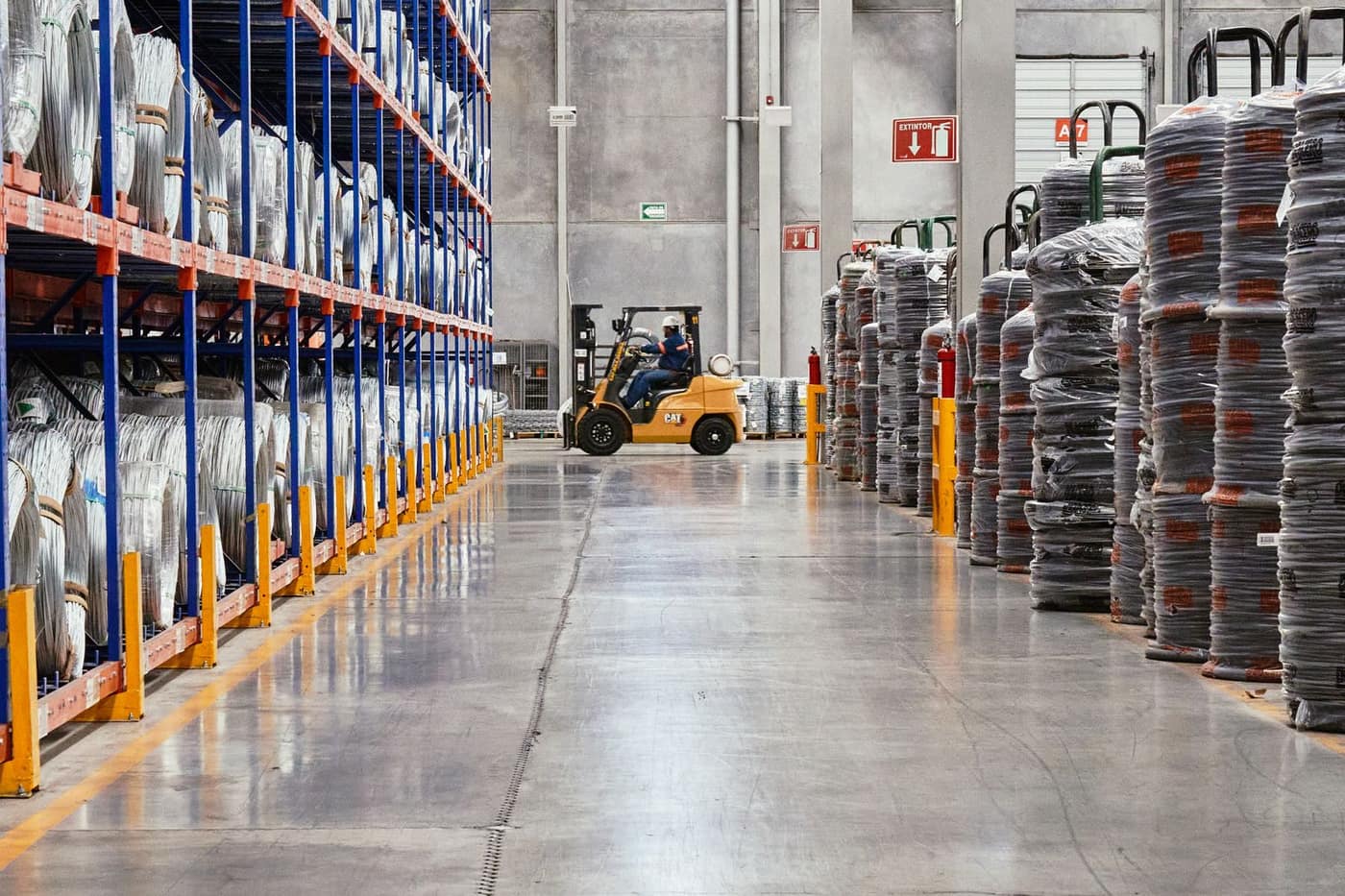 High-build epoxy floor running through a warehouse forklift aisle
