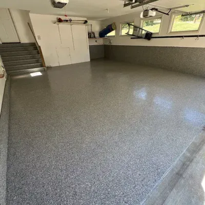 Durable epoxy flooring in a clean garage for optimal durability and style.