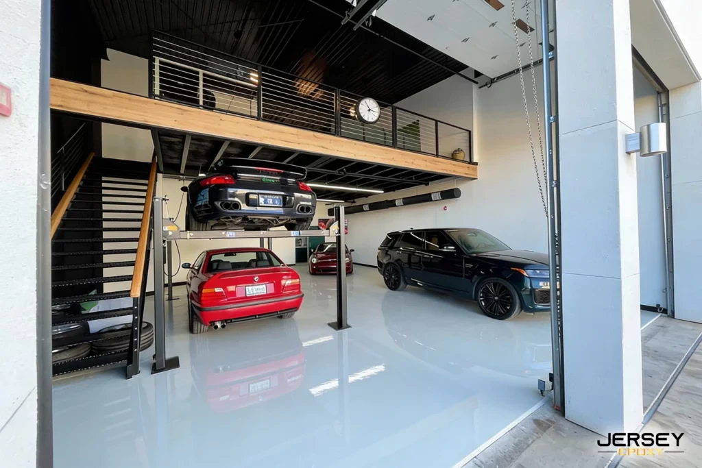 Can You Install Epoxy in a Condo Garage Floor in Winter? Polished epoxy garage floor with car storage in modern industrial style.